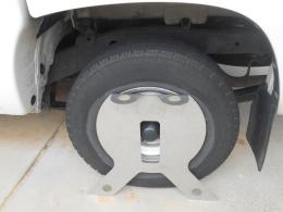 shows the stainless steel shield standing in front of the vehicles wheel